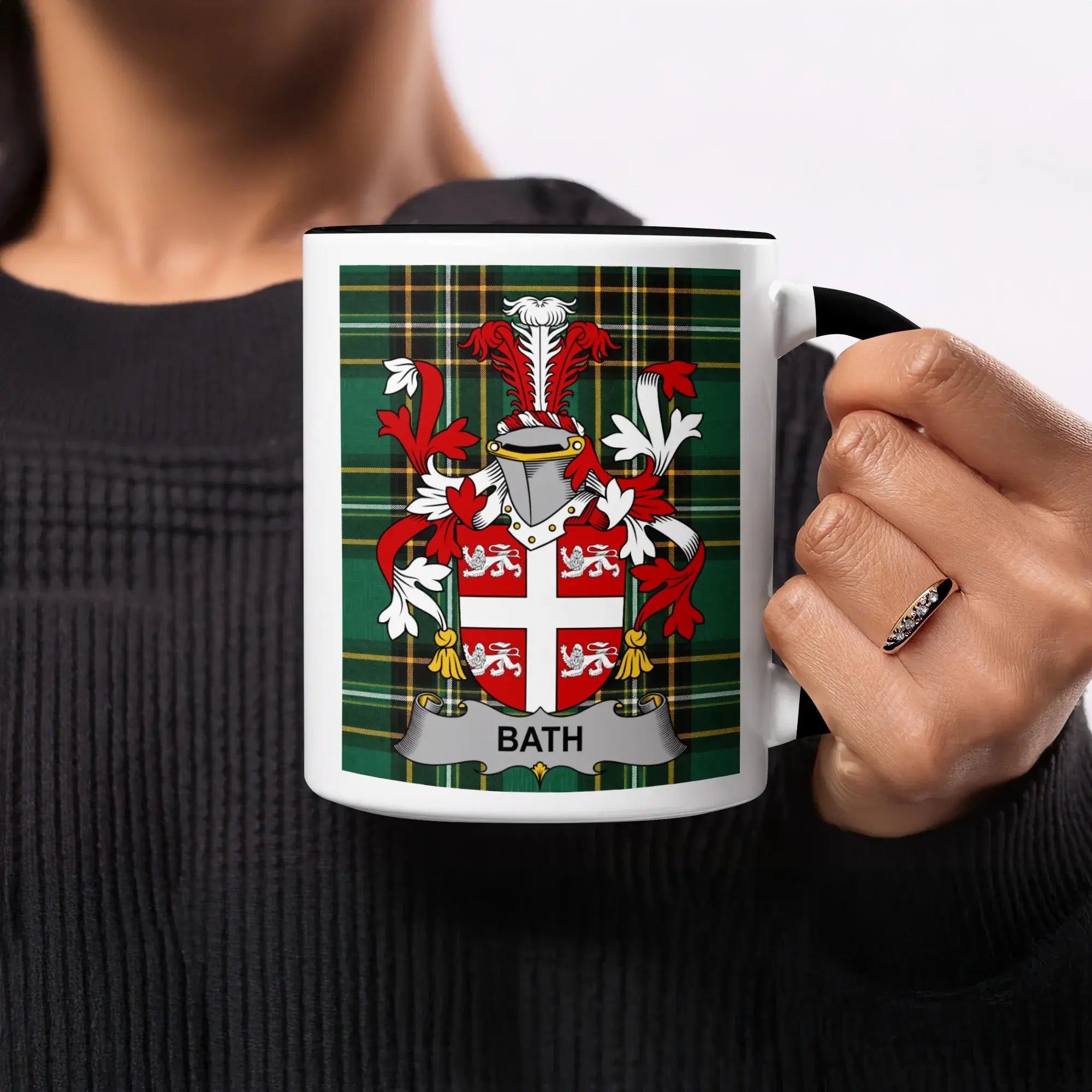 Mug with Bath family crest on green tartan background.
