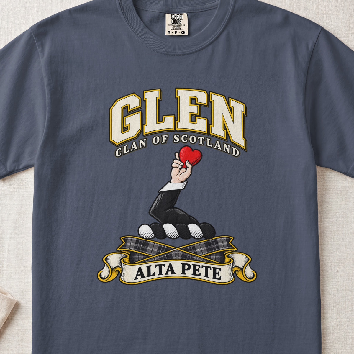 Glen Scottish clan T-shirt in Midnight, front view with a hand holding a red heart and motto banner.