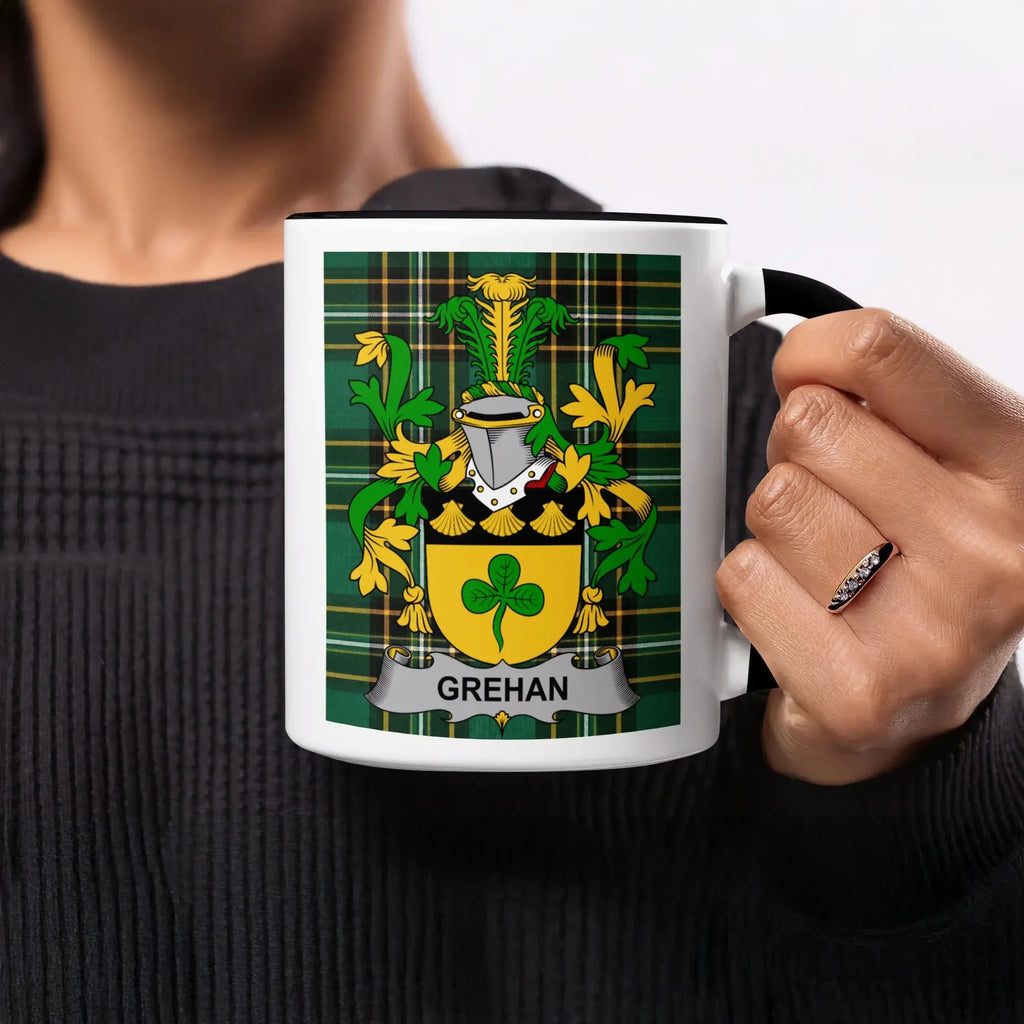 Tartan mug with a coat of arms featuring a shield and "GREHAN" text.
