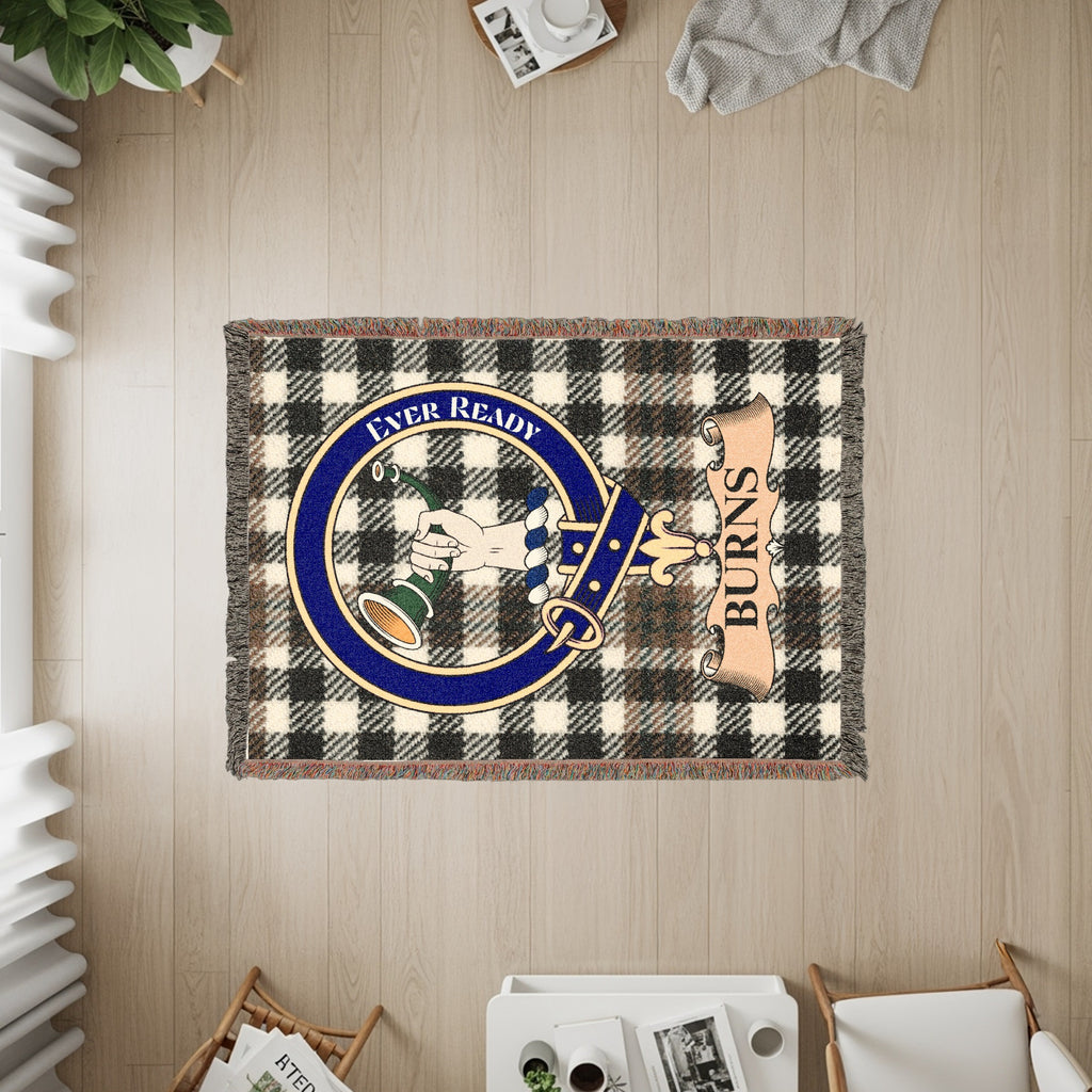 Tapestry with black and white plaid, a circular crest with a hand, and "BURNS" text.