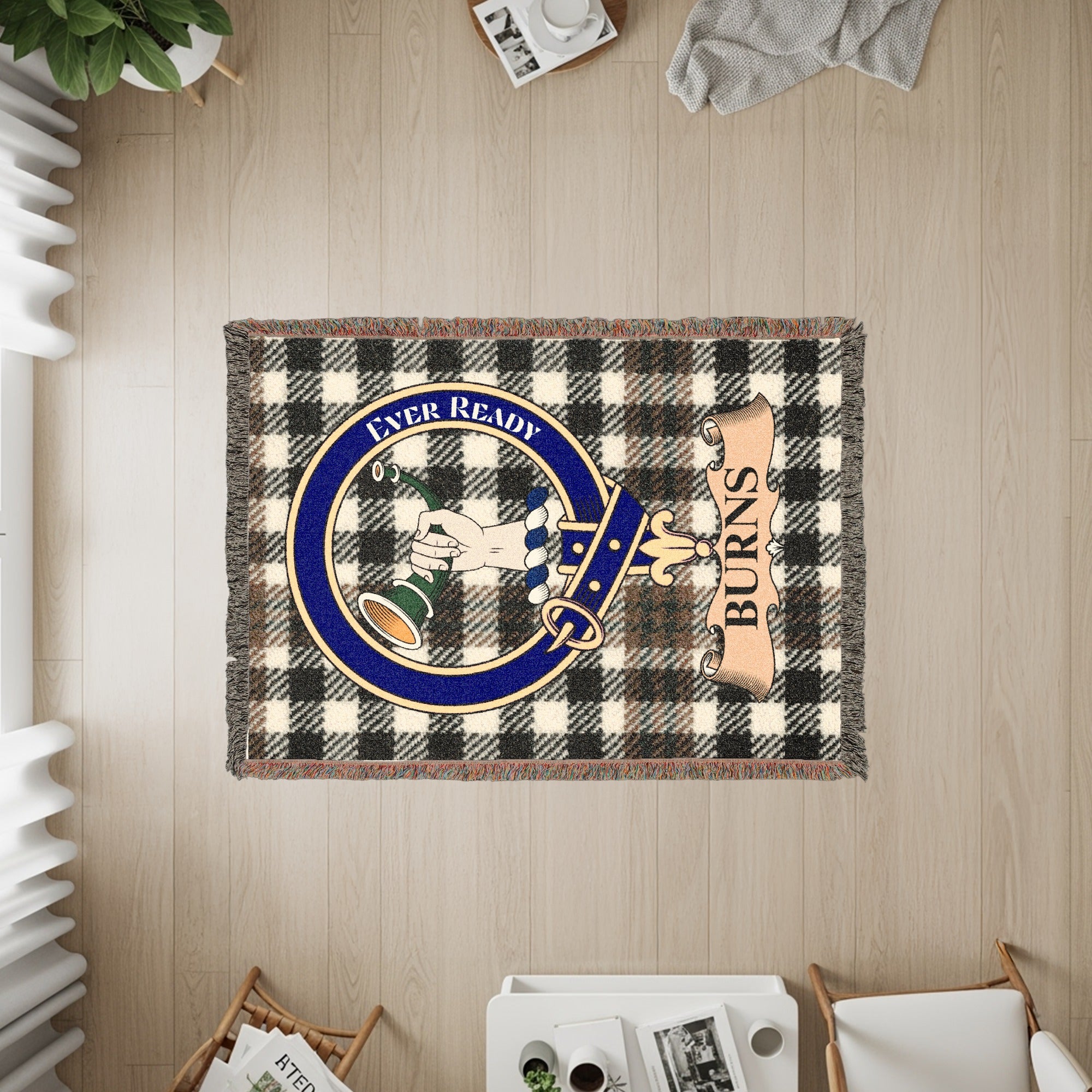 Tapestry with black and white plaid, a circular crest with a hand, and "BURNS" text.
