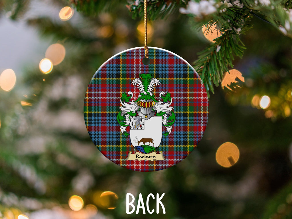 Raeburn ceramic ornament detail showing a double-sided family shield on a Caledonia tartan background