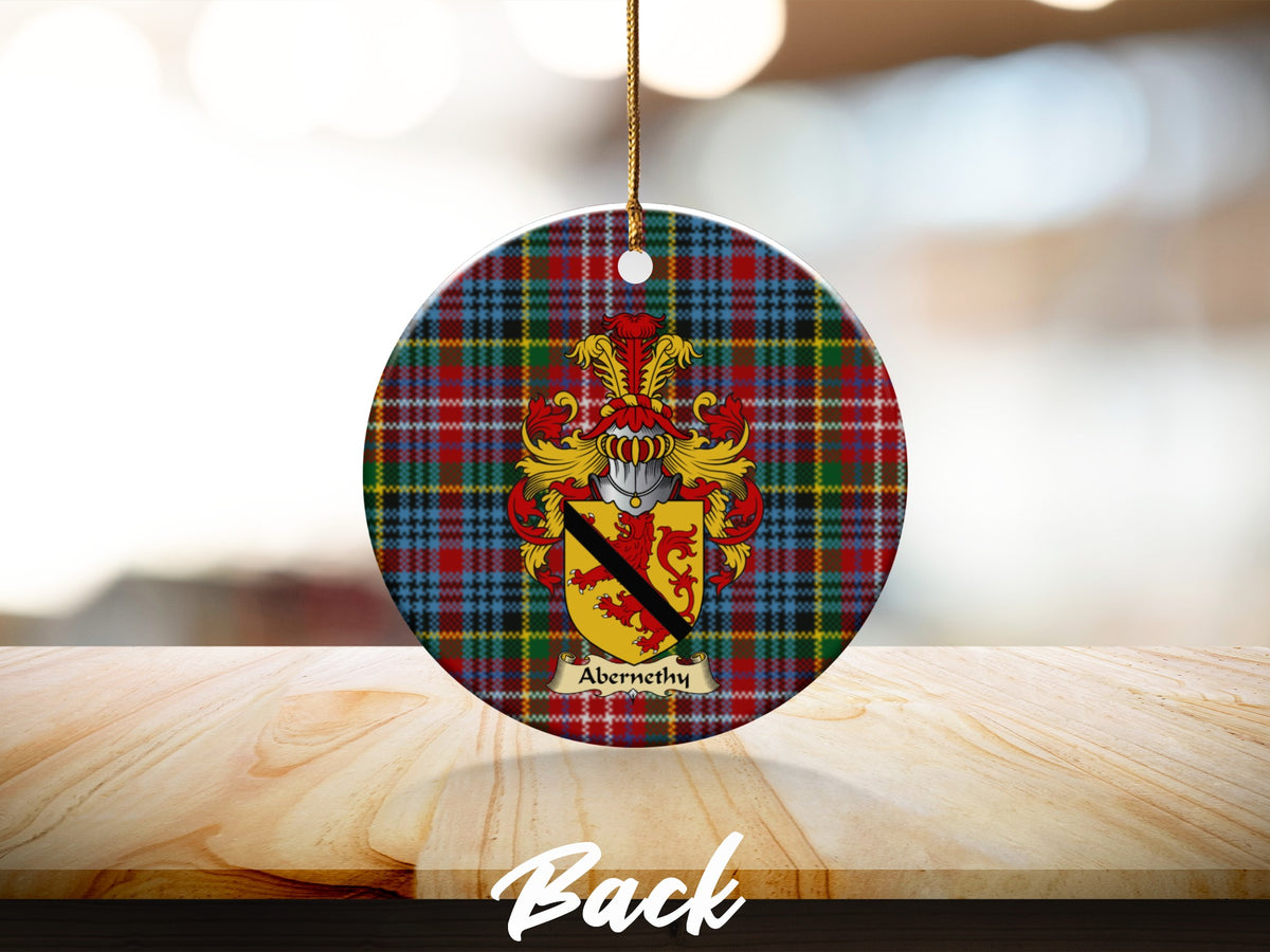 Round Abernethy Scottish clan ornament with family crest on a Caledonia tartan background