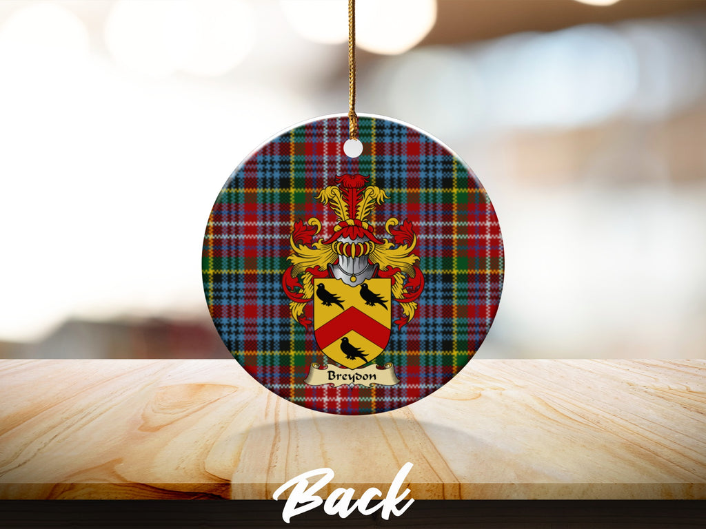 Round Breydon Scottish clan ornament with family crest on a Caledonia tartan background
