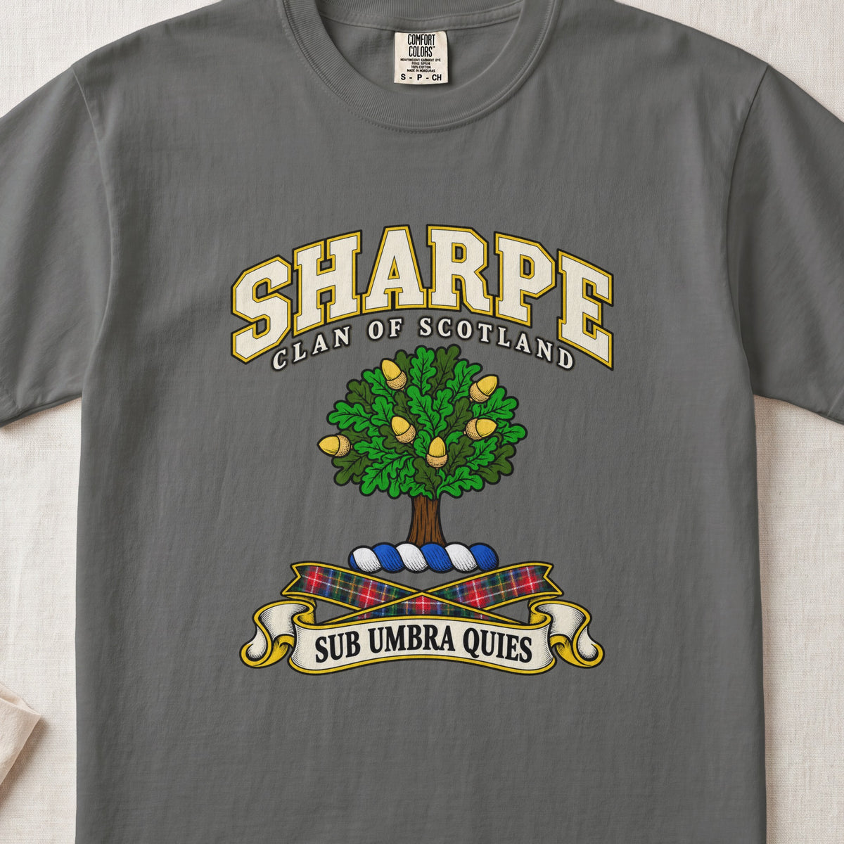 Sharpe Scottish clan T-shirt in Pepper, front view with a green tree with golden acorns and motto design.
