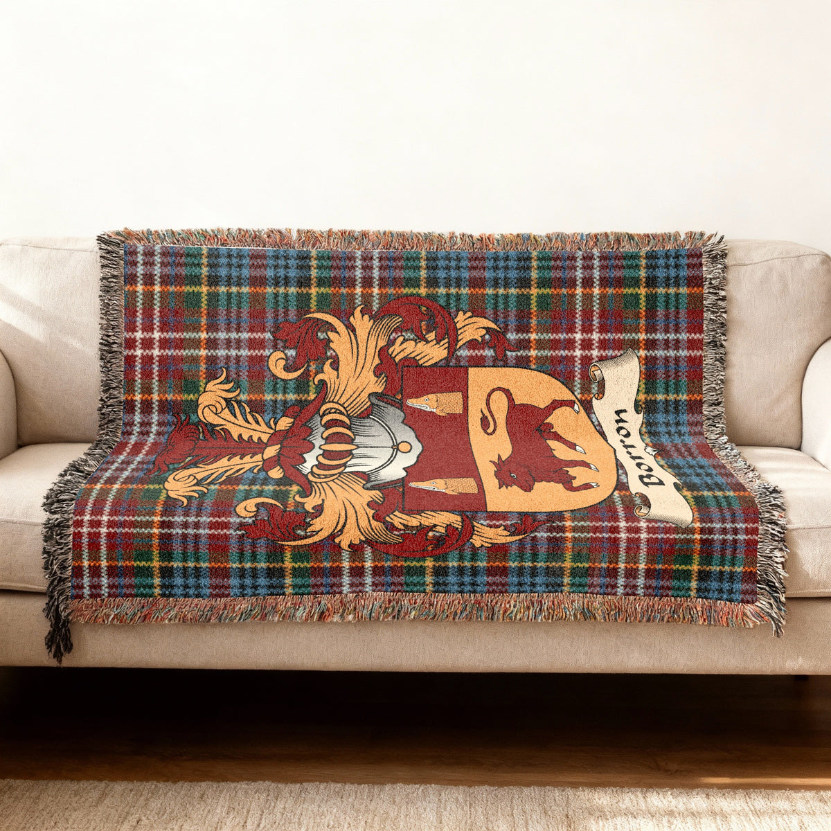 Borron Scottish woven blanket with family shield and Caledonia tartan background