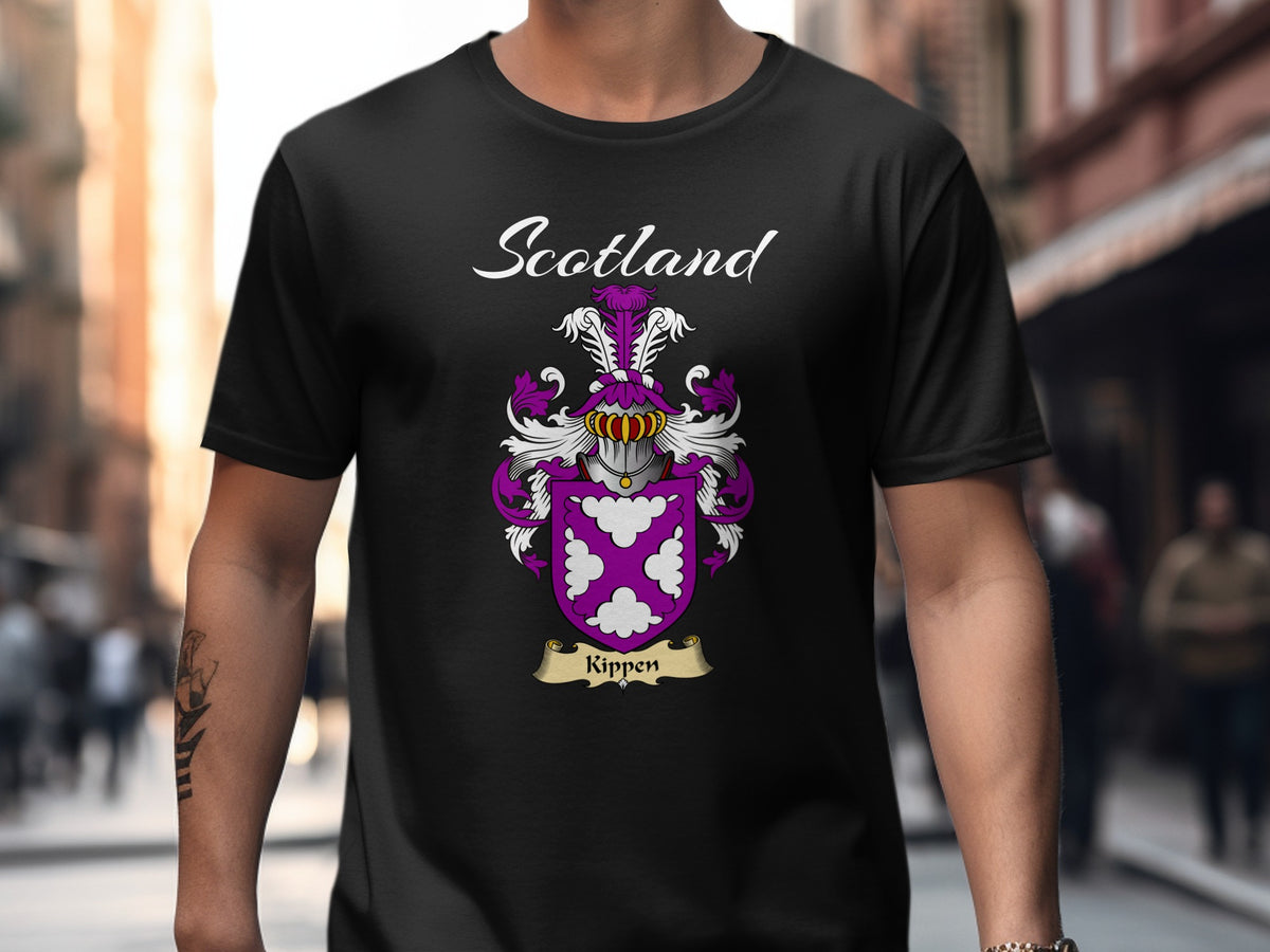 Model wearing a black Kippen T-shirt featuring white decorative motifs on a purple shield