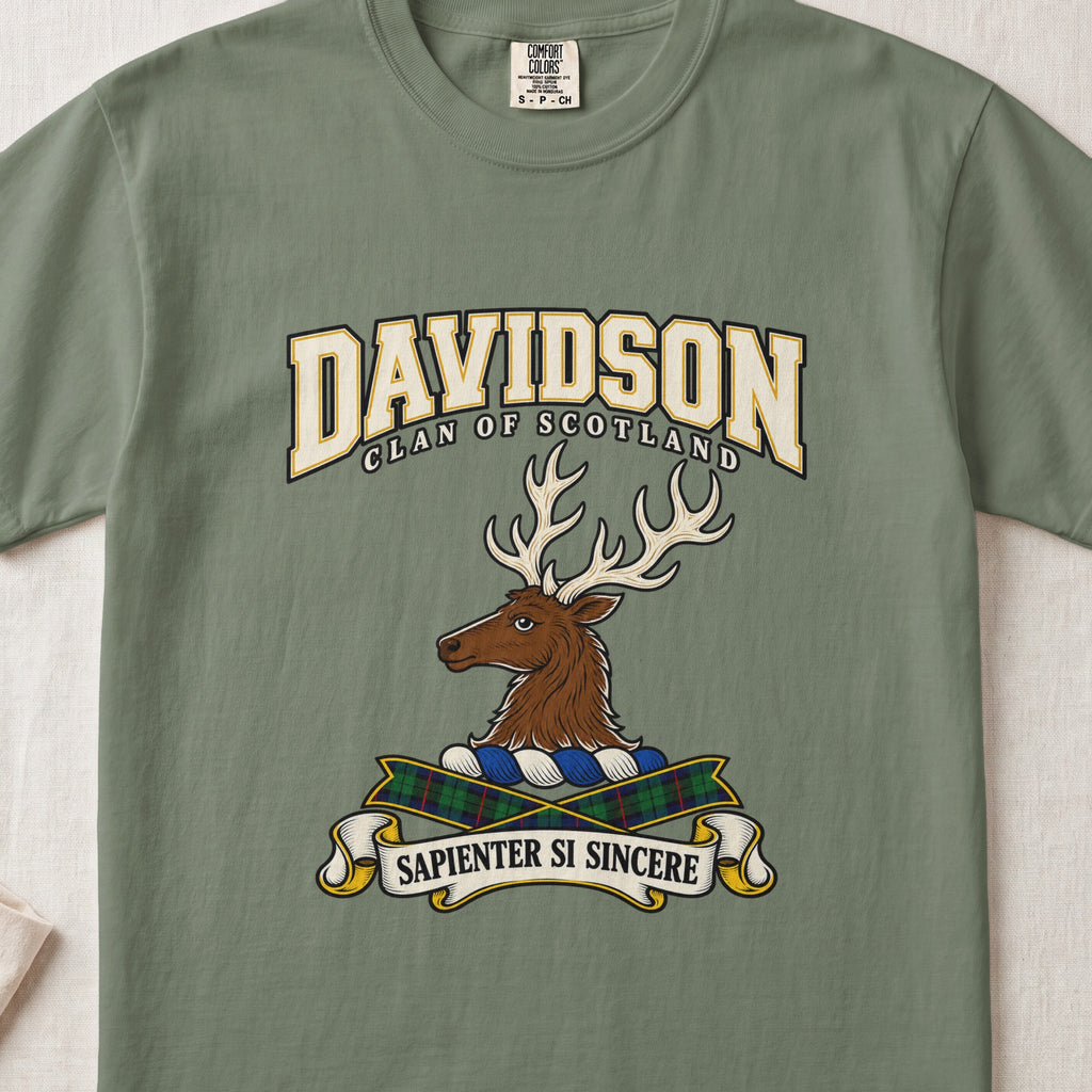Moss green Davidson Scottish clan T-shirt, front flat lay with cream varsity lettering, stag crest and tartan ribbon.