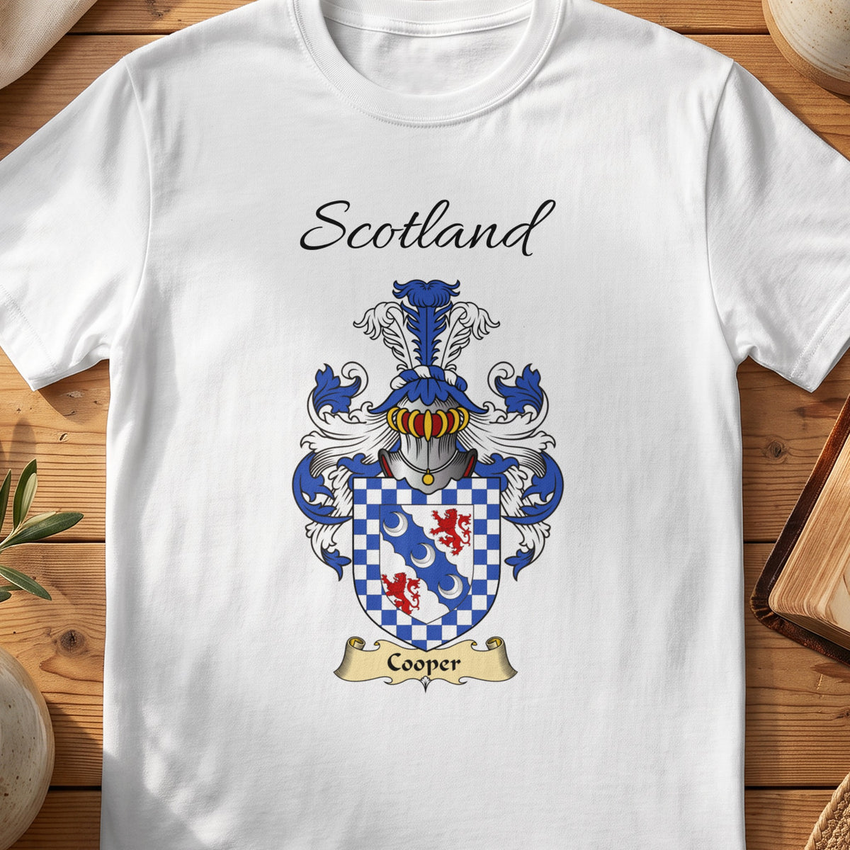 White Cooper Scottish family shield T-shirt featuring a blue diagonal band inside a checked border