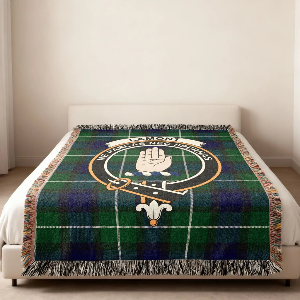 Lamont clan tartan woven blanket with crest design — heraldic design at centre, fringe edge visible