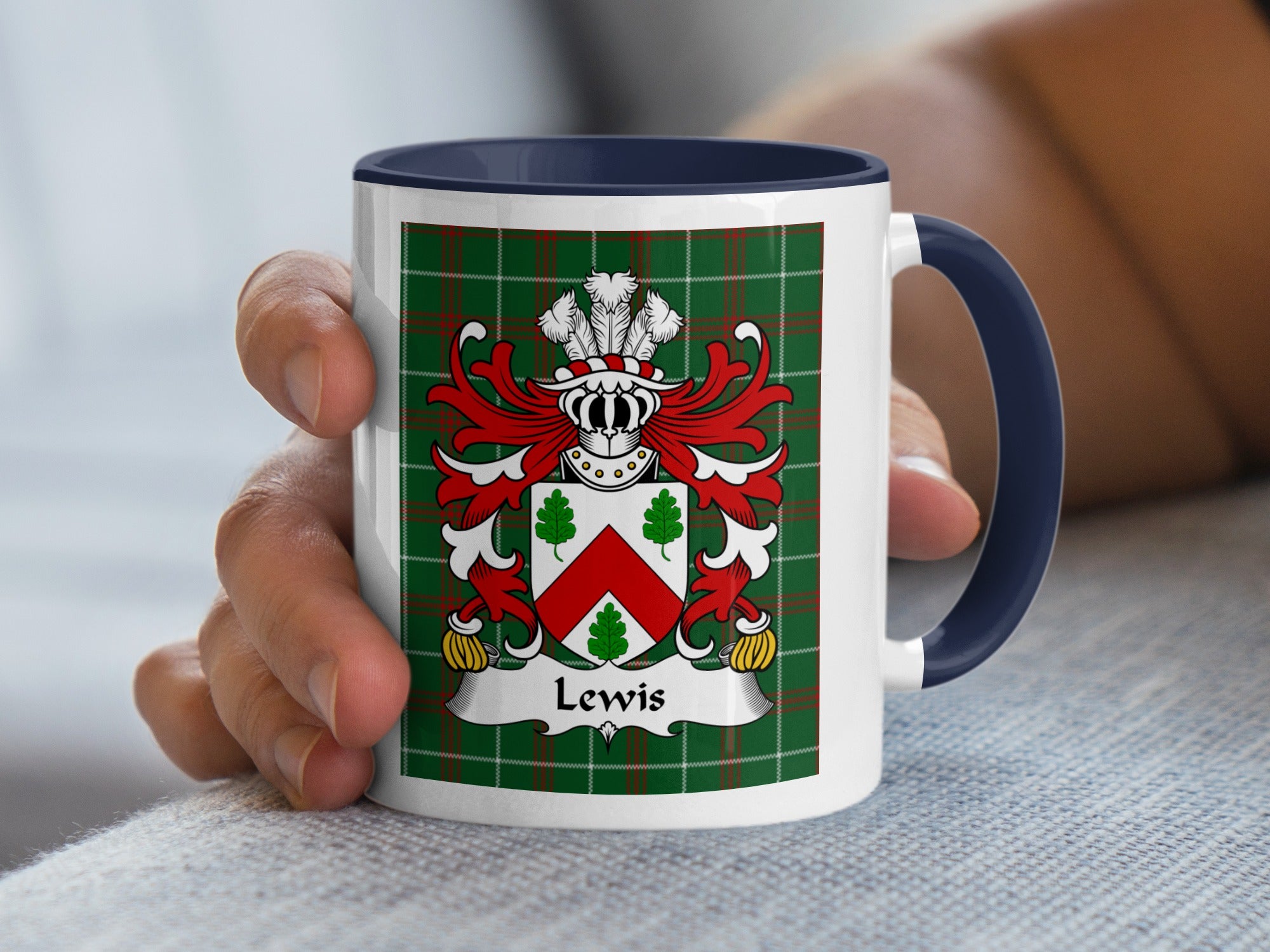 White mug with navy blue handle featuring a Lewis family crest on a green plaid background.