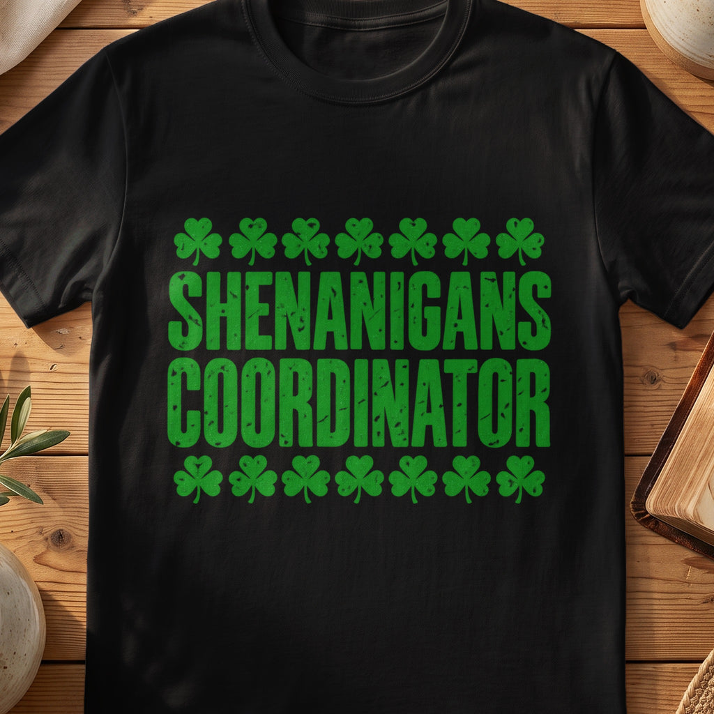 Black funny Irish T-shirt with green shamrocks and “Shenanigans Coordinator” text.