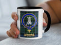 Clan Malcolm tartan accent mug with black handle — 11oz glossy ceramic showing tower crest and In Ardua Tendit motto