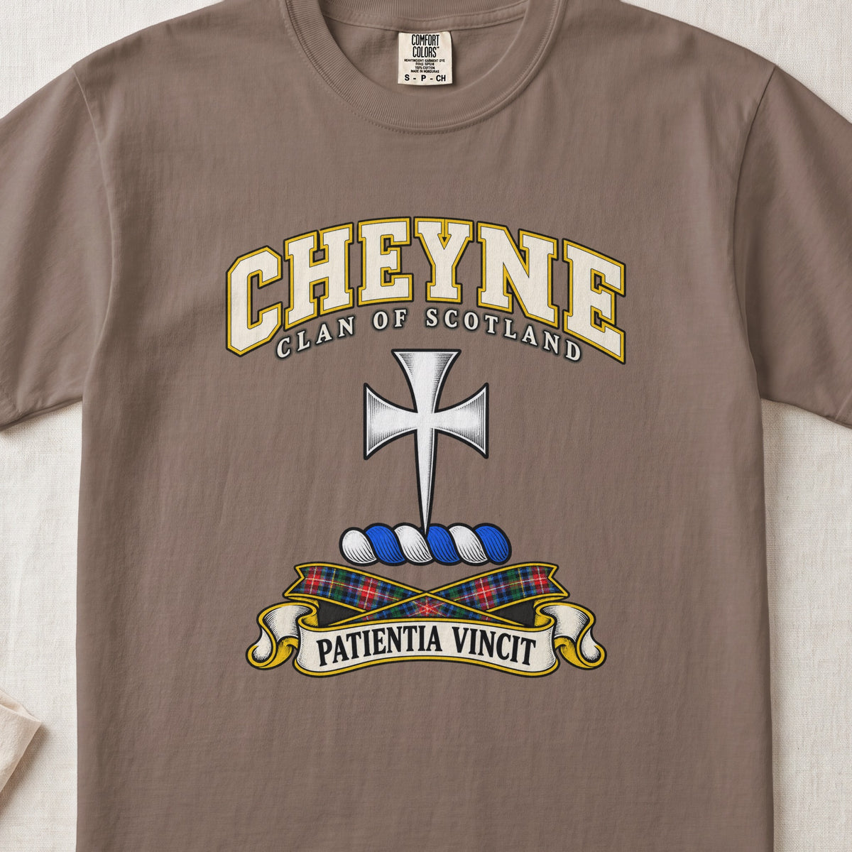 Cheyne Scottish clan T-shirt in Espresso, front view with a silver cross with flared arms and motto design.