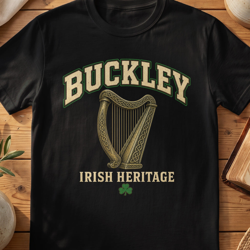 Buckley Irish harp T-shirt in Black, with cream surname lettering, a gold-toned harp, green shamrock and “Irish Heritage” text.