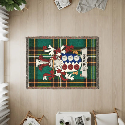 Hickman family crest on a green plaid woven blanket.
