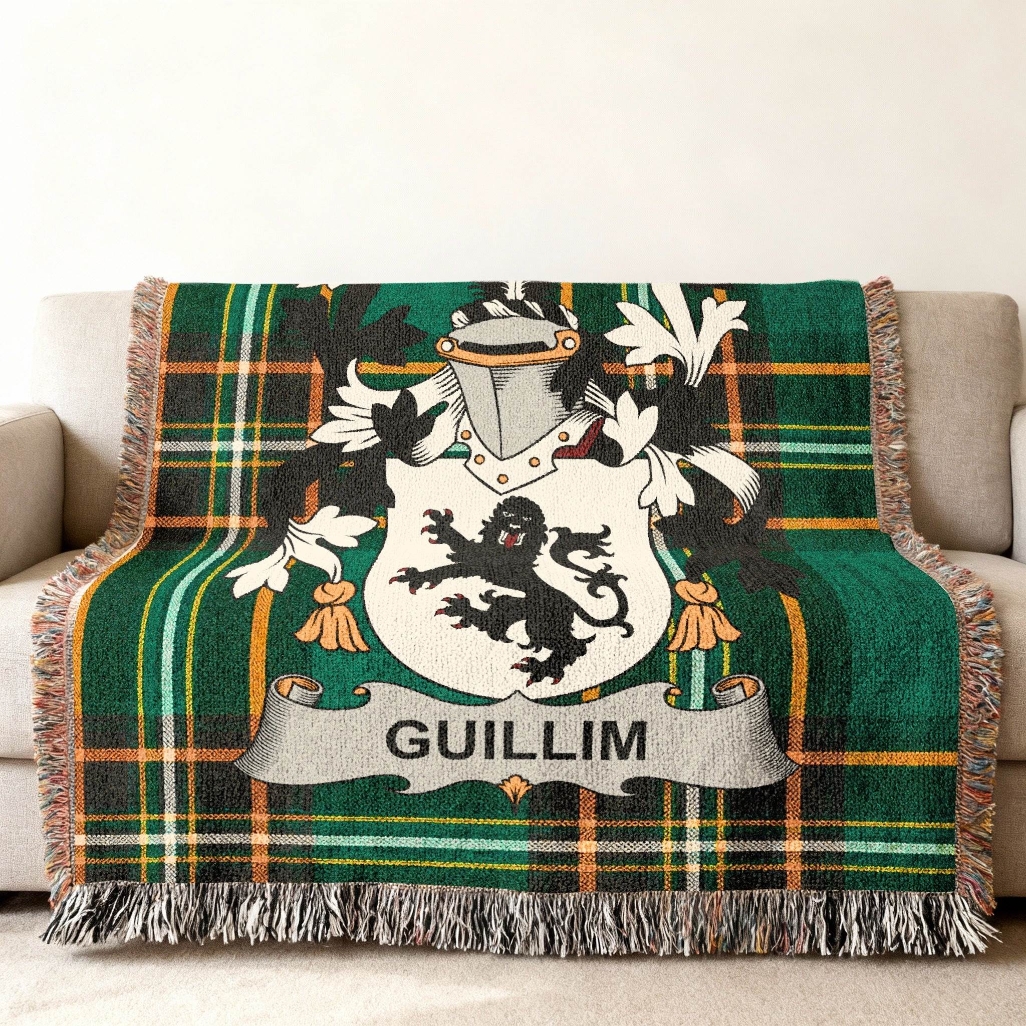 Green plaid throw blanket with a Guillim family crest.