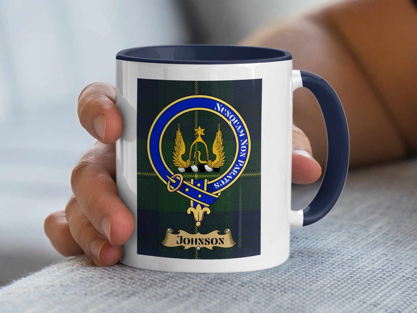 White mug with navy blue rim, featuring the Johnson clan crest on a tartan background.