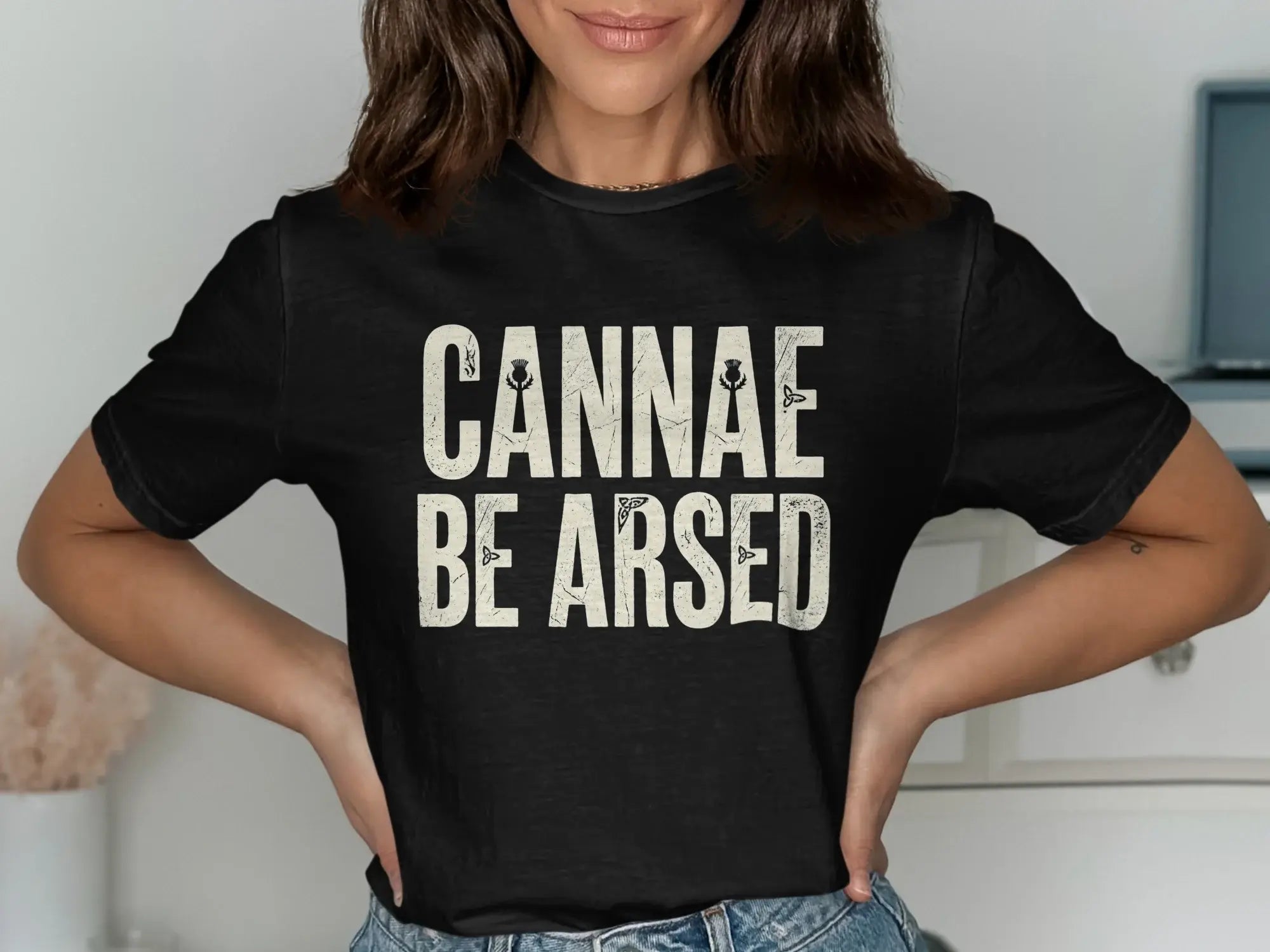 Black t-shirt with white text CANNAE BE ARSED.