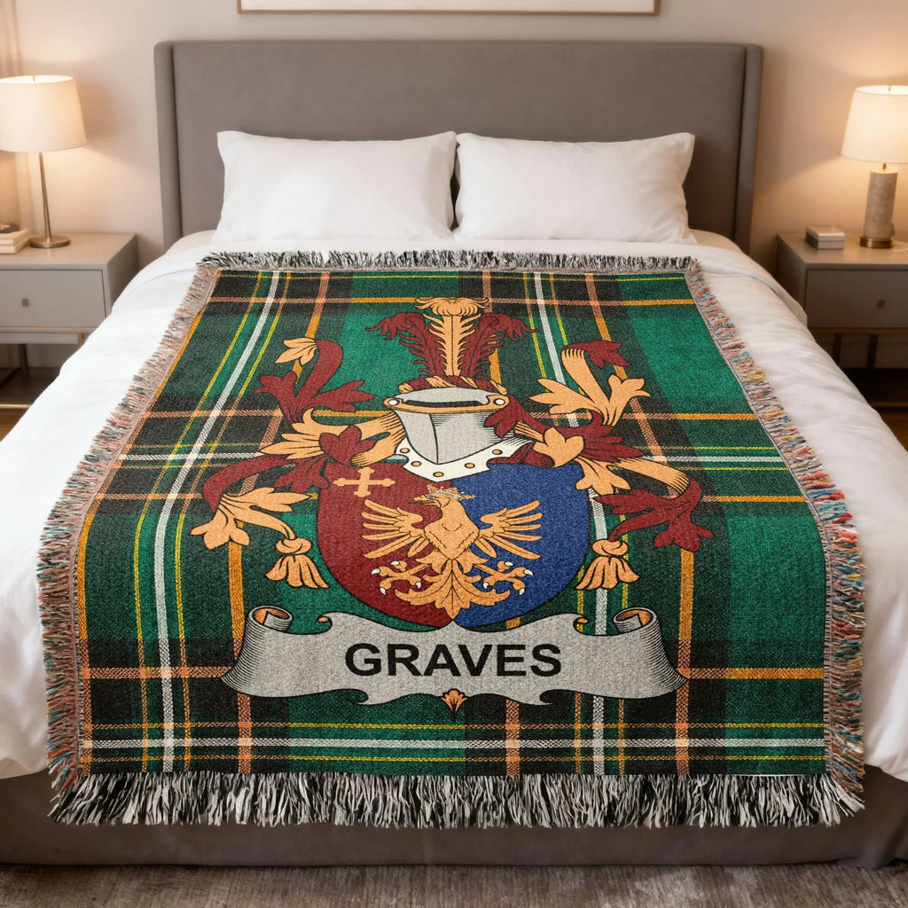 Tartan blanket with Graves family crest on a bed.