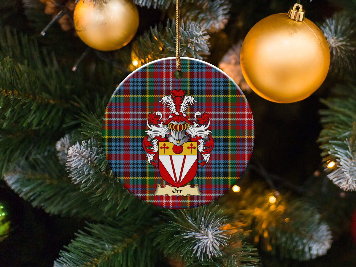 Orr family emblem ceramic Christmas ornament with Caledonia tartan background in festive holiday décor