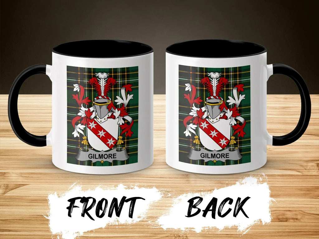 Two white mugs with black rims, each displaying the Gilmore family crest.