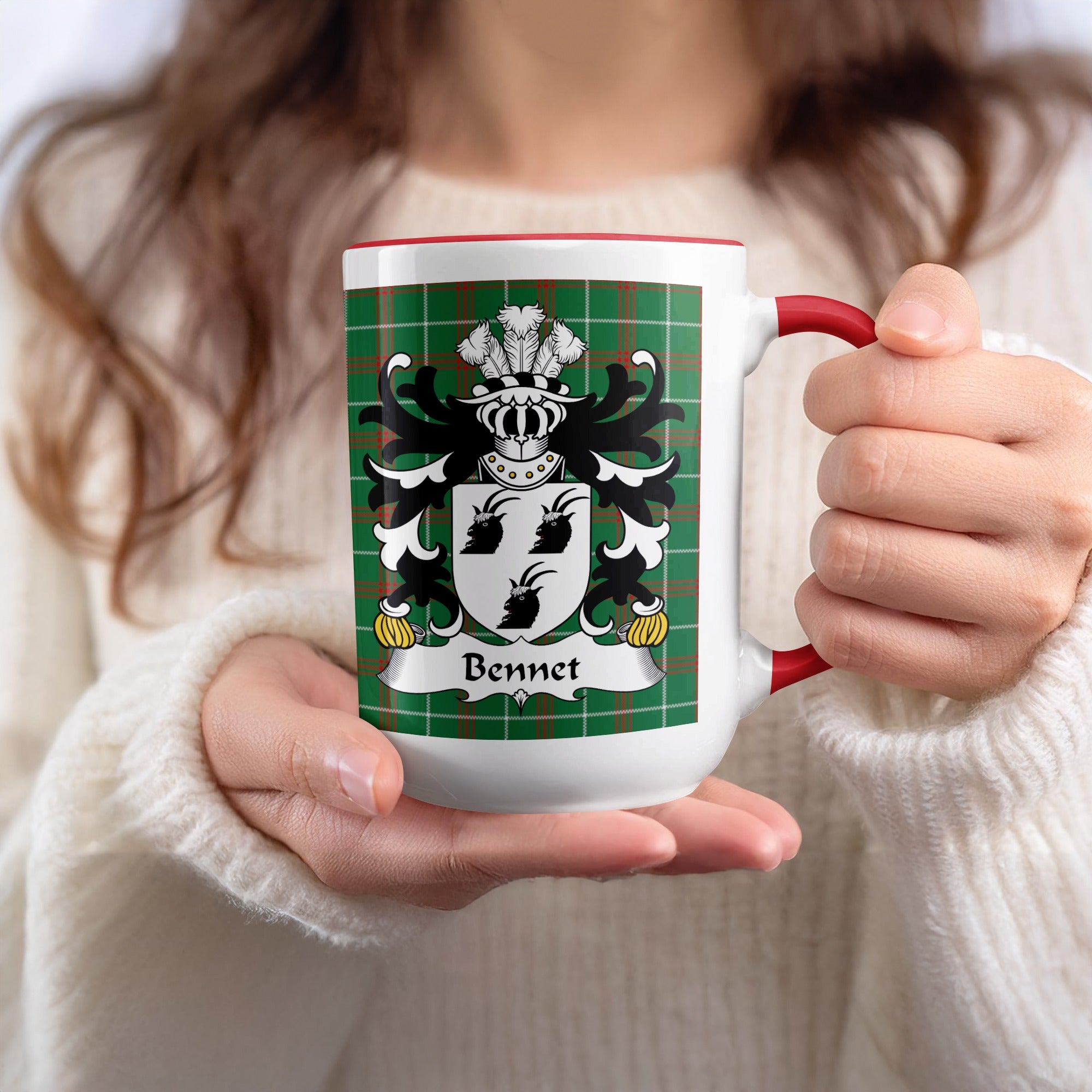 White mug with Bennet coat of arms on green tartan design and red handle.