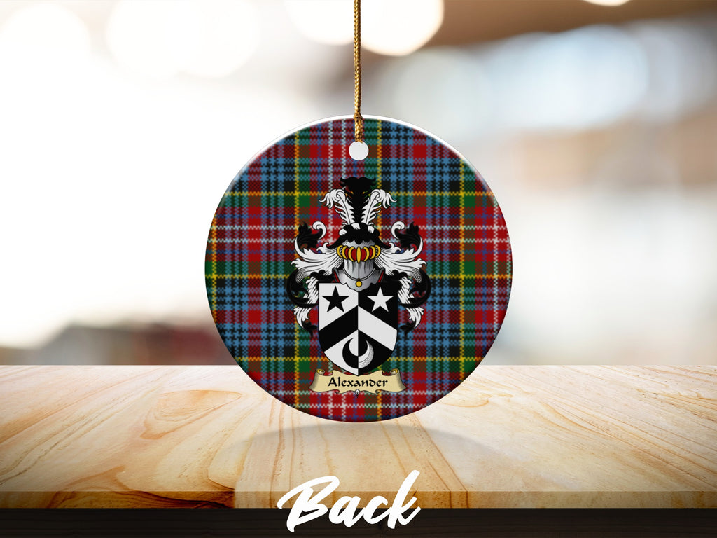 Round Alexander Scottish clan ornament with family crest on a Caledonia tartan background