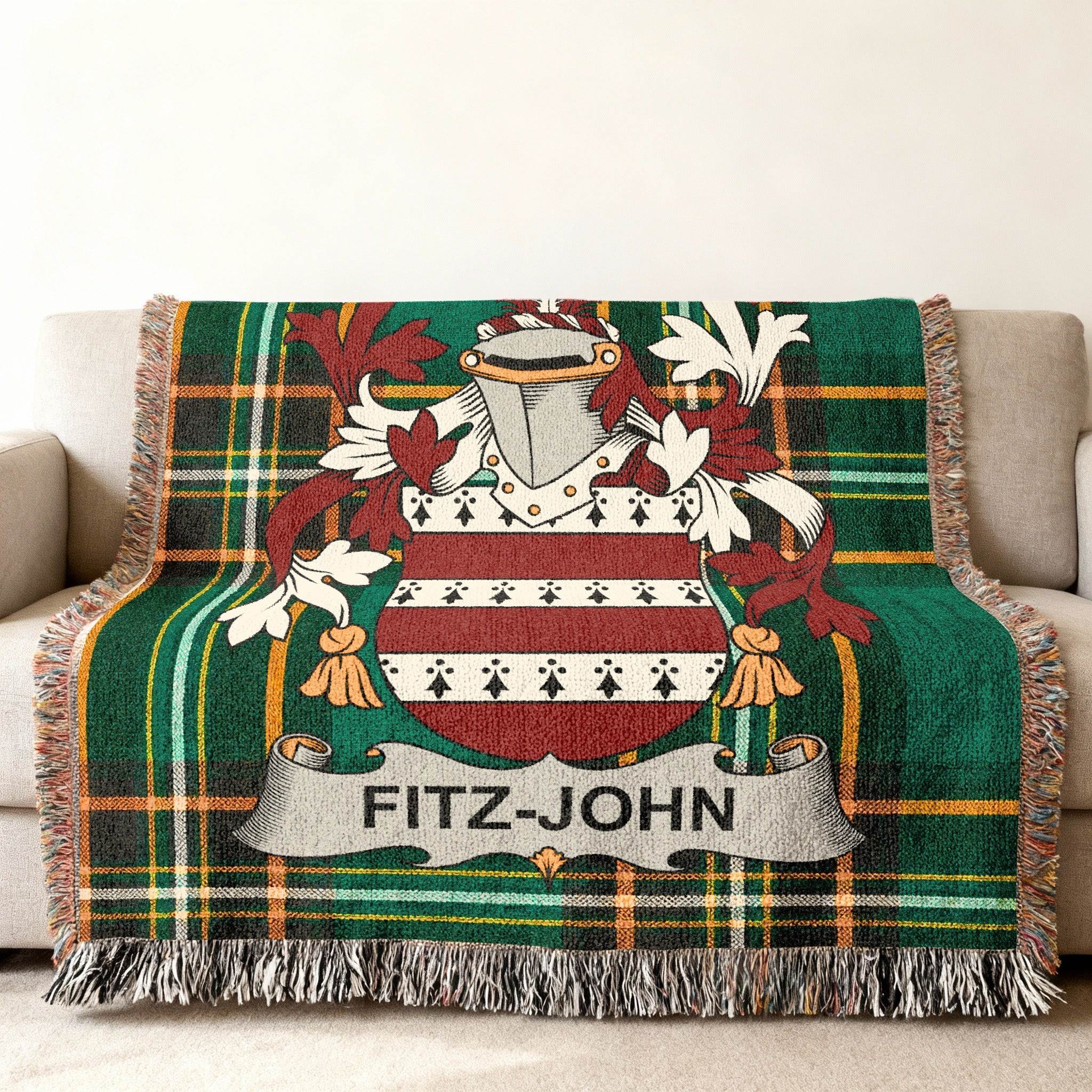 Fitz-John family crest on a green plaid throw blanket.