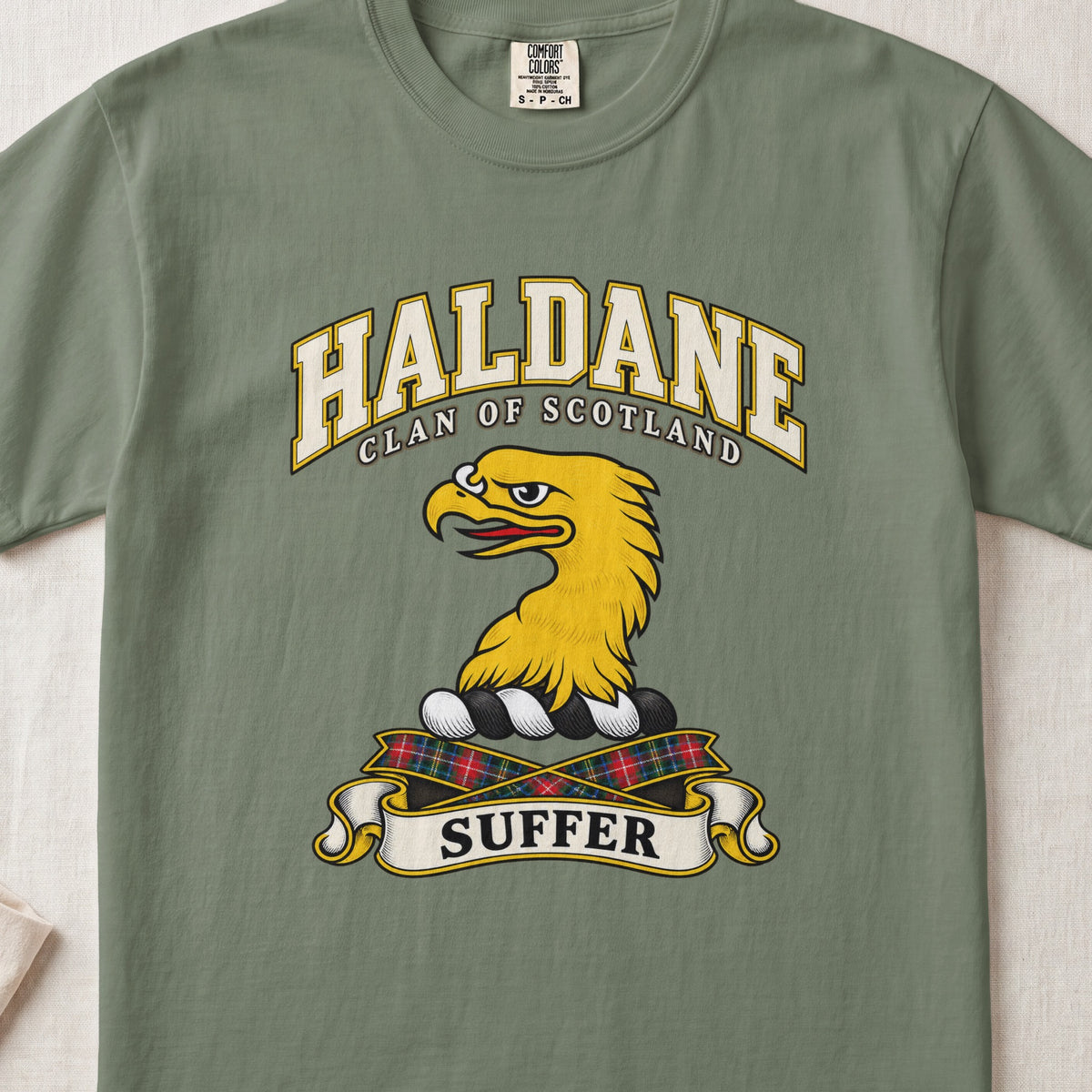 Haldane Scottish clan T-shirt in Moss, front view with a gold eagle head and motto design.