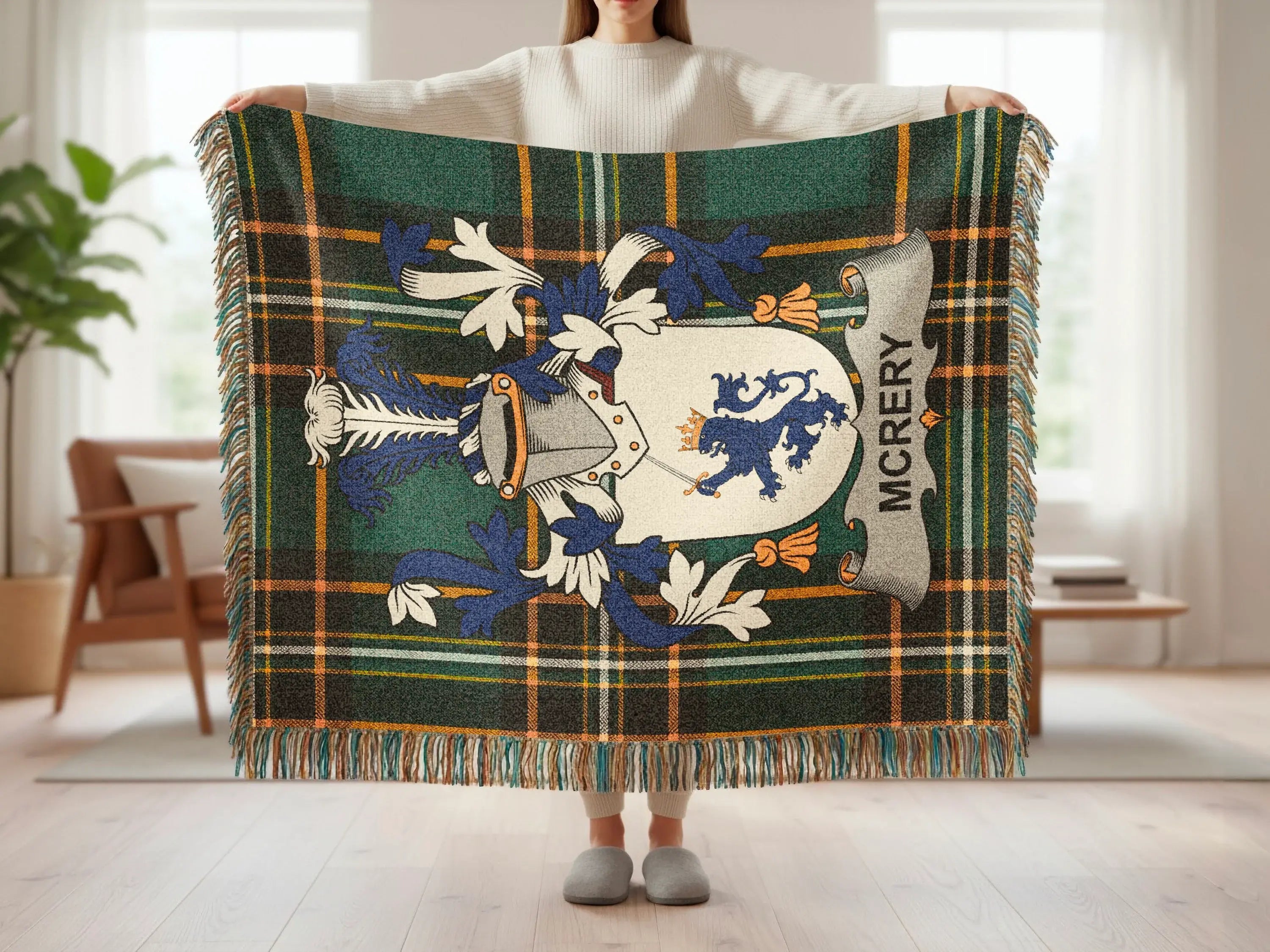 Tartan blanket with family crest and "MCRERY" text.
