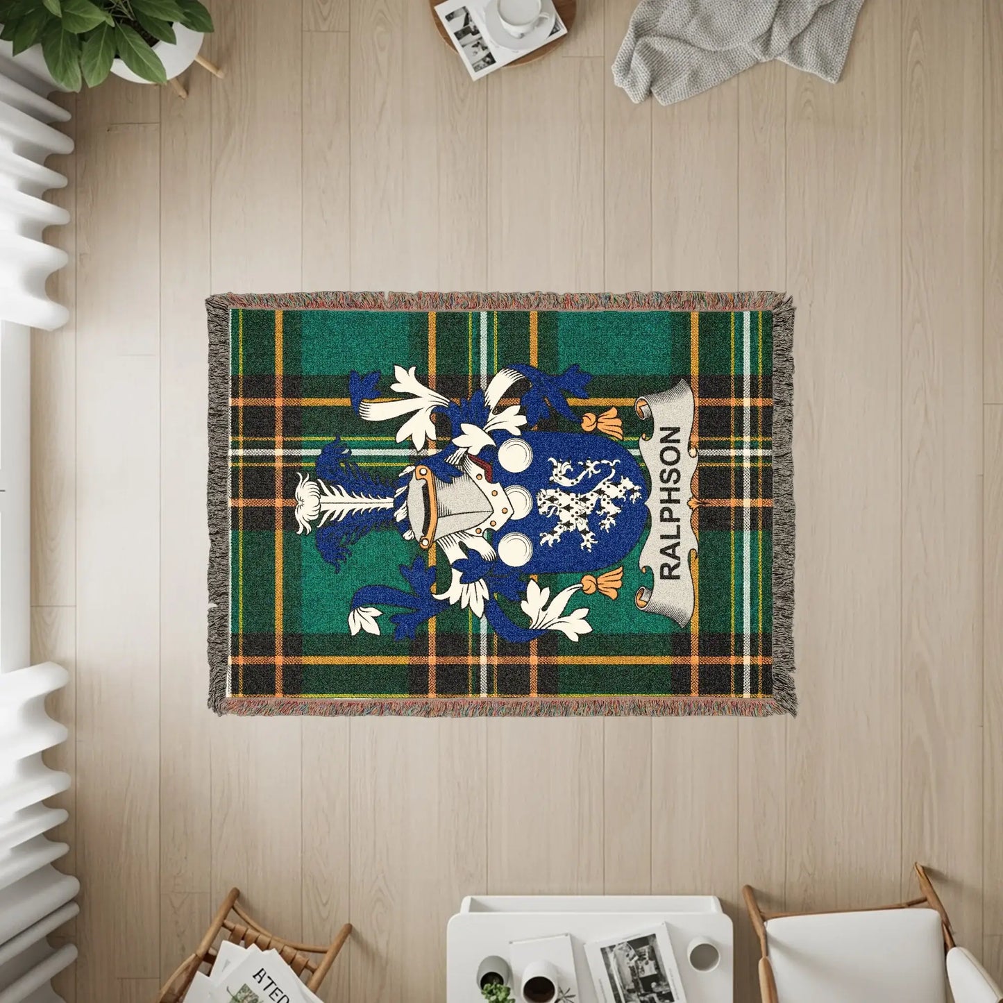 Ralphson tartan blanket with coat of arms in center.