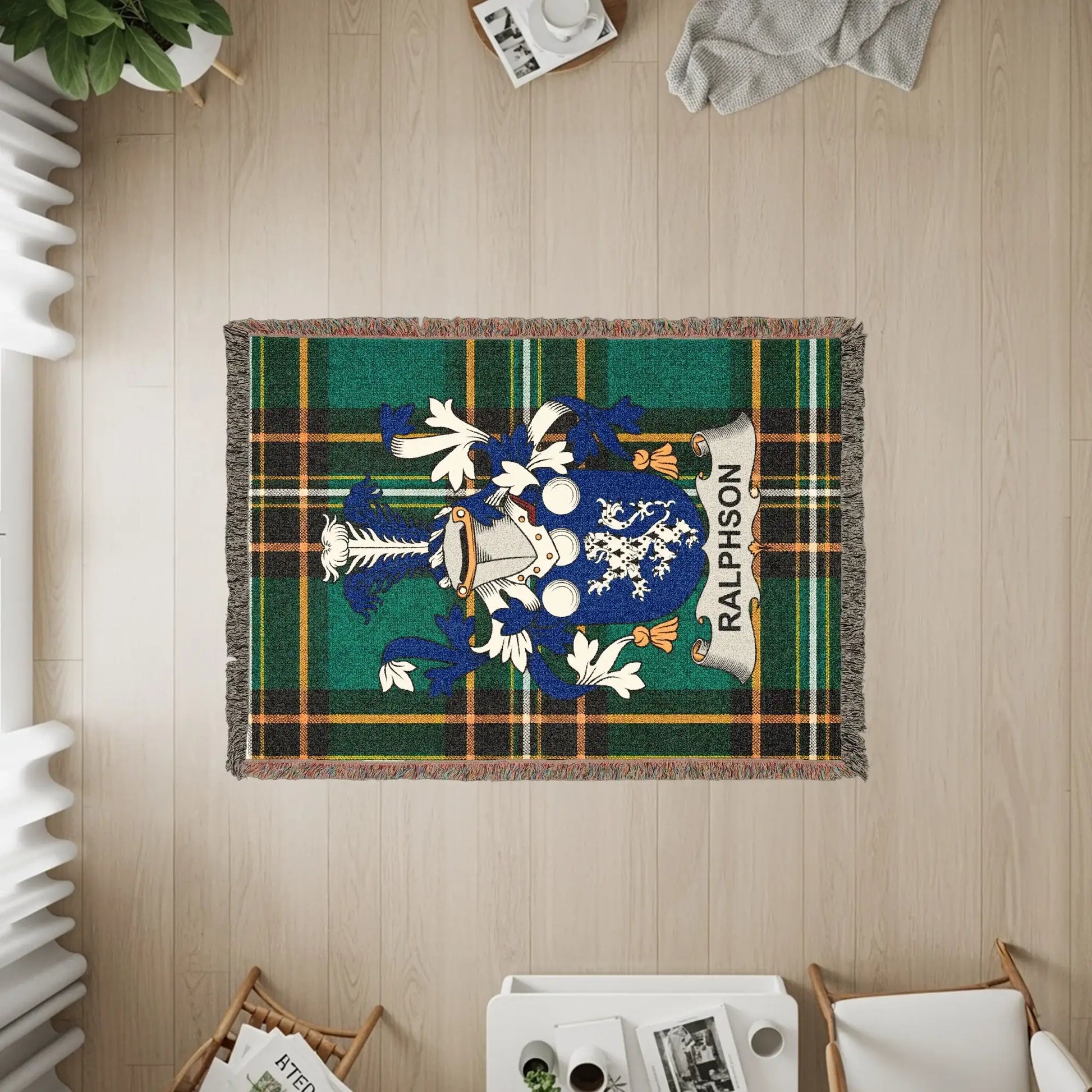 Ralphson tartan blanket with coat of arms in center.
