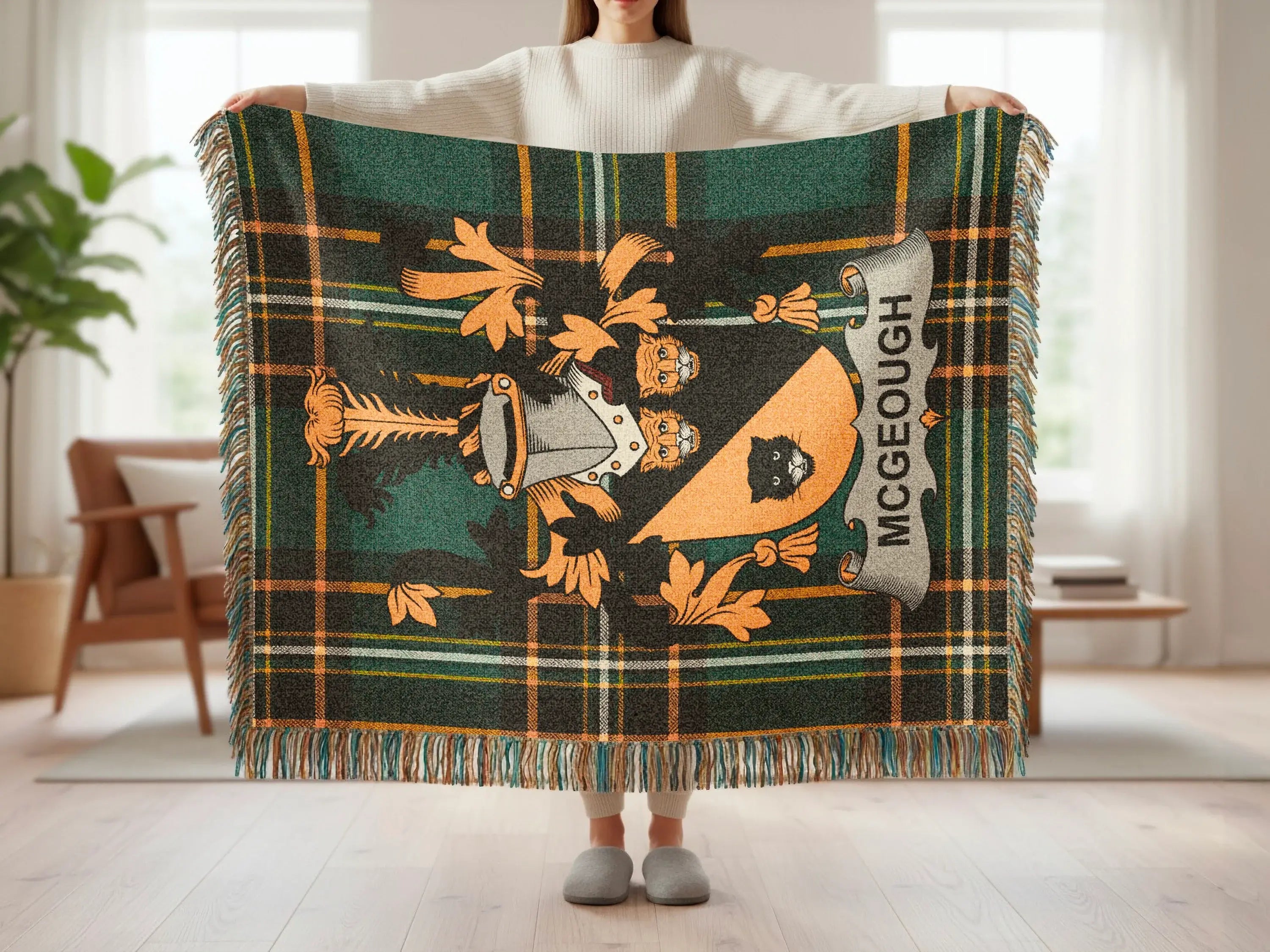 Tartan blanket with crest, featuring the name "MCGEOUGH".