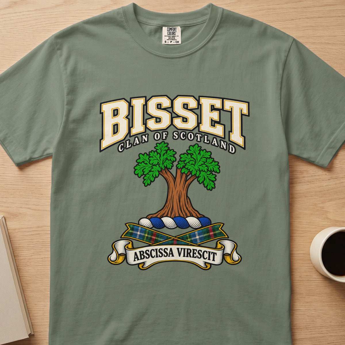 Bisset double-canopied green tree crest graphic on a sage green Comfort Colors T-shirt, front view