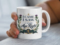 White mug with Scottish thistle design and text "I Came. I Saw. I Said Aye Right."