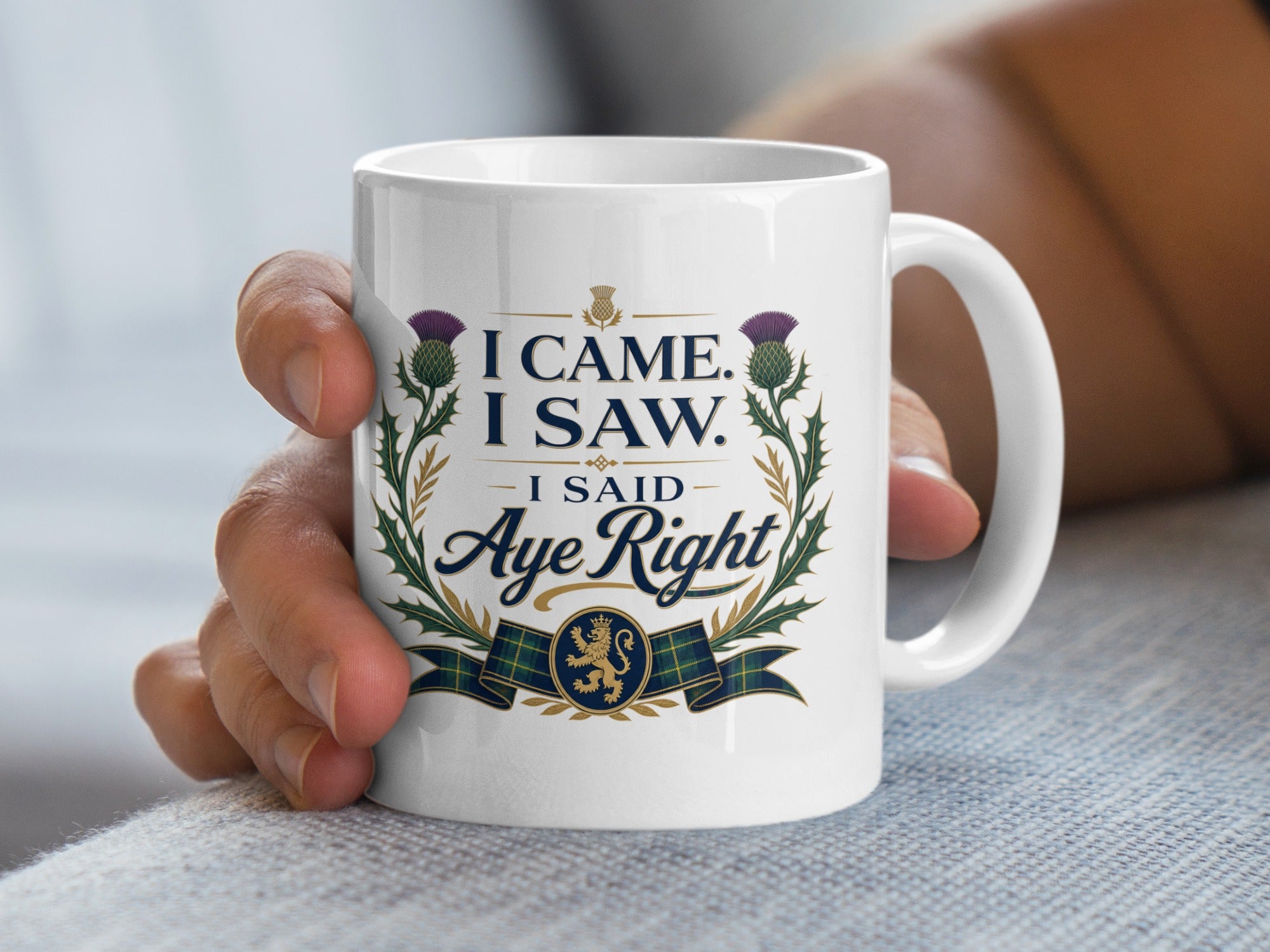 White mug with Scottish thistle design and text "I Came. I Saw. I Said Aye Right."