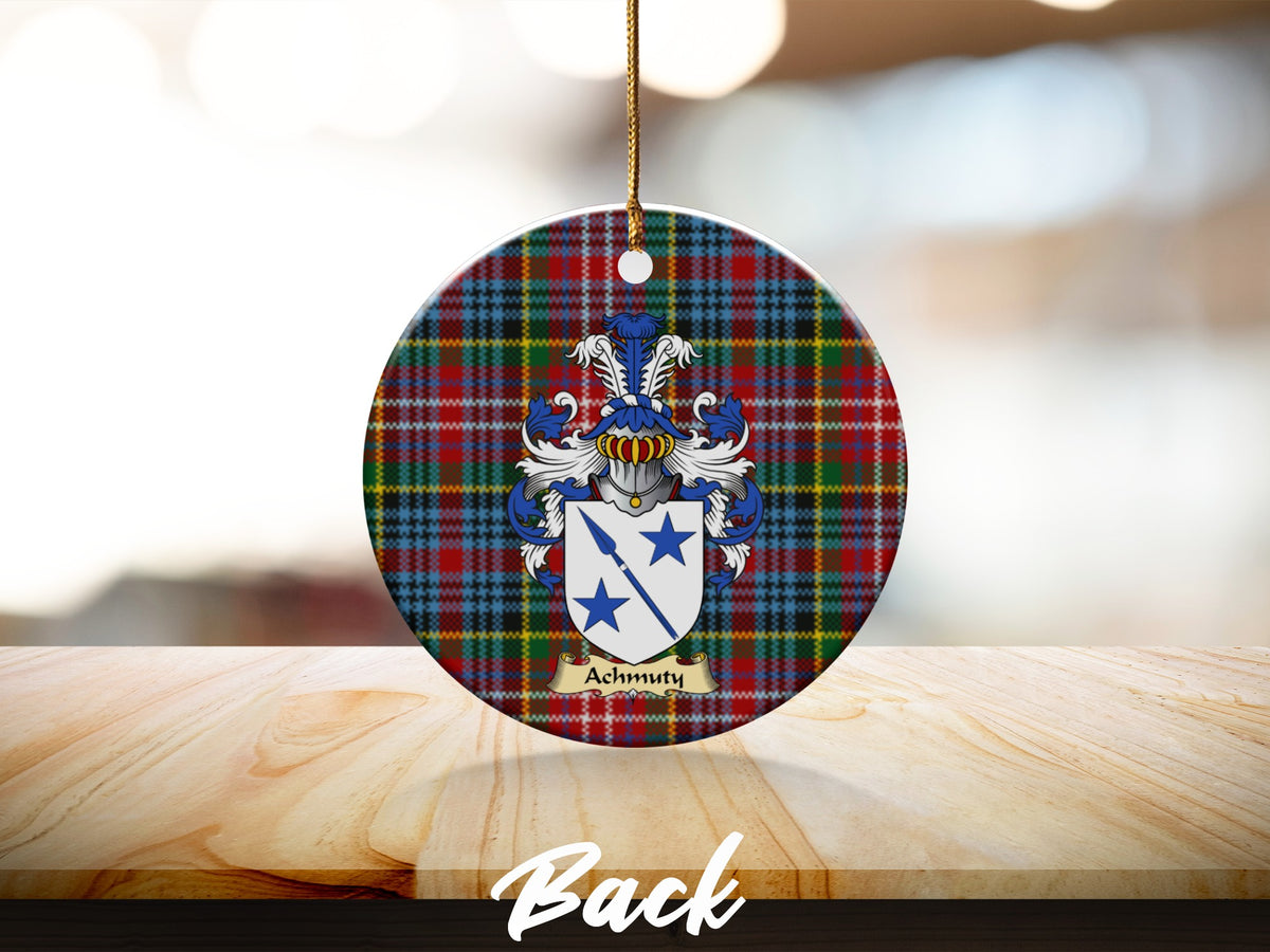 Round Achmuty Scottish clan ornament with family crest on a Caledonia tartan background