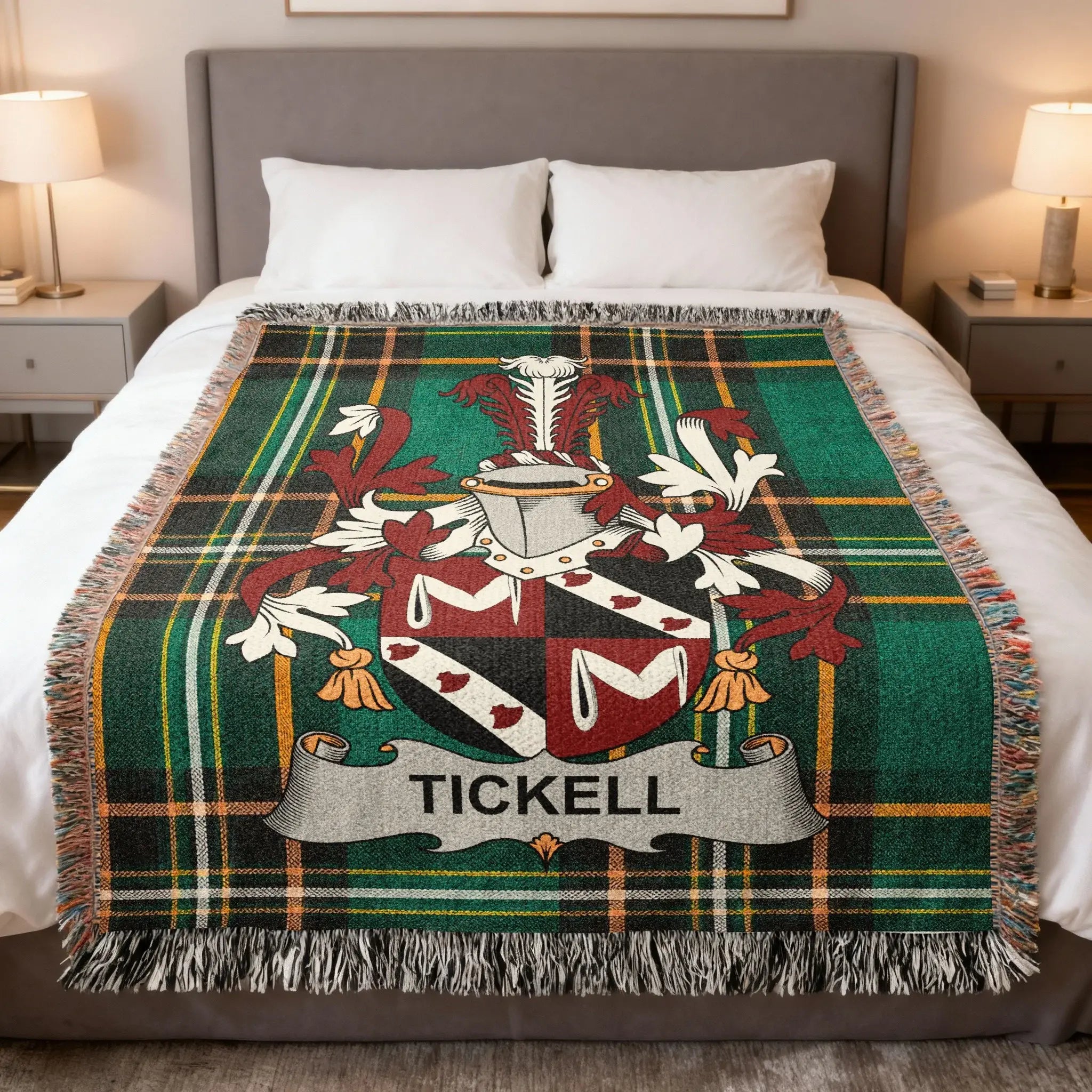 Tartan blanket with the Tickell family crest on a bed.