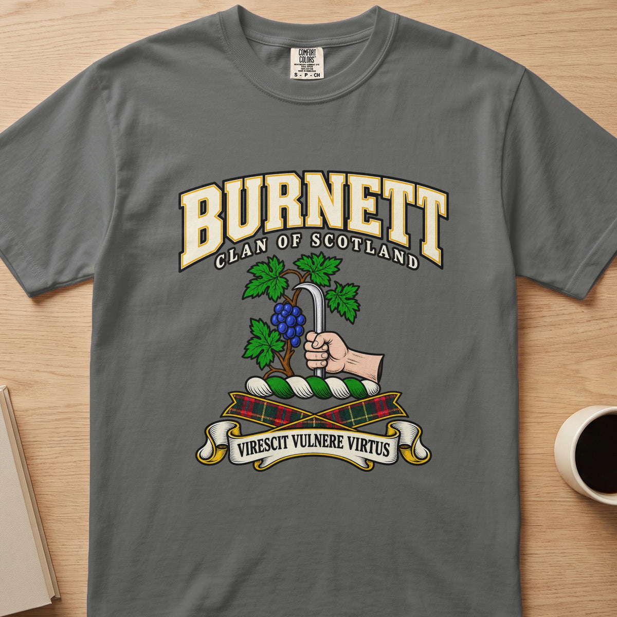 Burnett clan crest with grapevine and pruning hook on a gray Comfort Colors T-shirt, front view