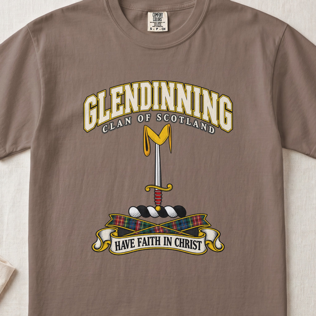 Glendinning Scottish clan T-shirt in Espresso, front view with an upright sword beneath a gold pennon and motto design.