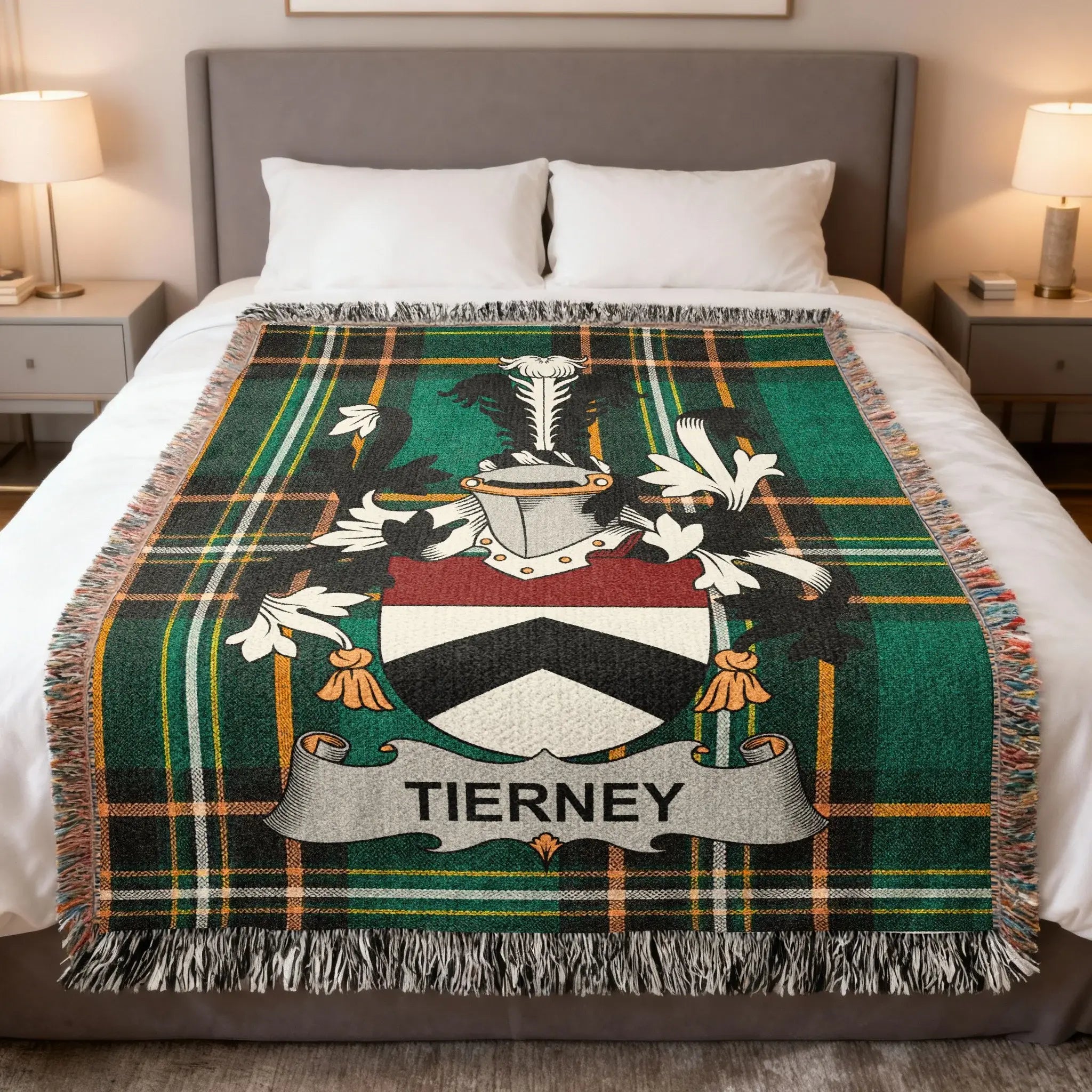 Tierney family crest on a green tartan plaid blanket on a bed.