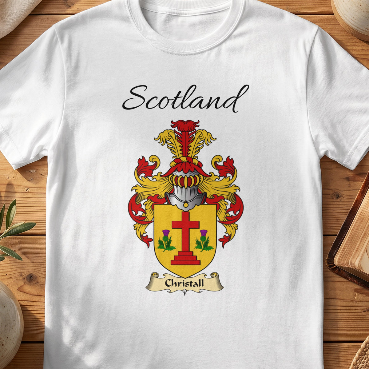 White Christall Scottish family shield T-shirt featuring a red cross between green sprigs on gold