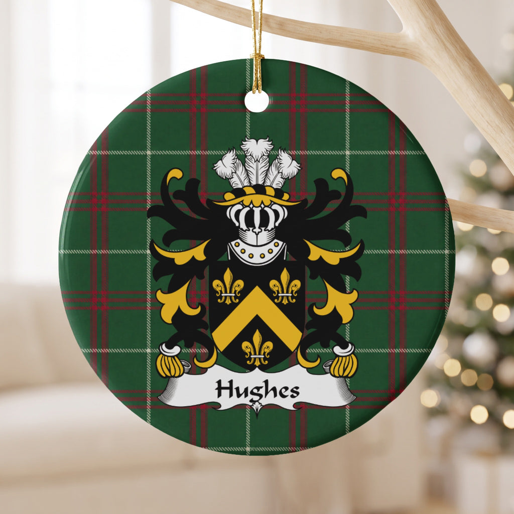 Hughes Style 1 ornament hanging from a pale wooden branch; a gold chevron and three gold fleurs-de-lis on a black shield on Welsh national tartan.
