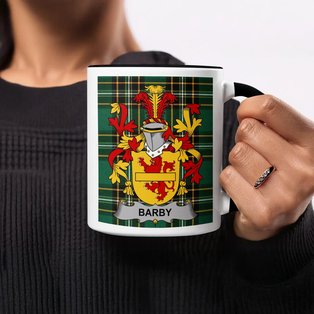 Mug with Barby family crest on green and yellow plaid background.