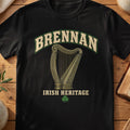 Brennan Irish harp T-shirt in Black, with cream surname lettering, a gold-toned harp, green shamrock and “Irish Heritage” text.