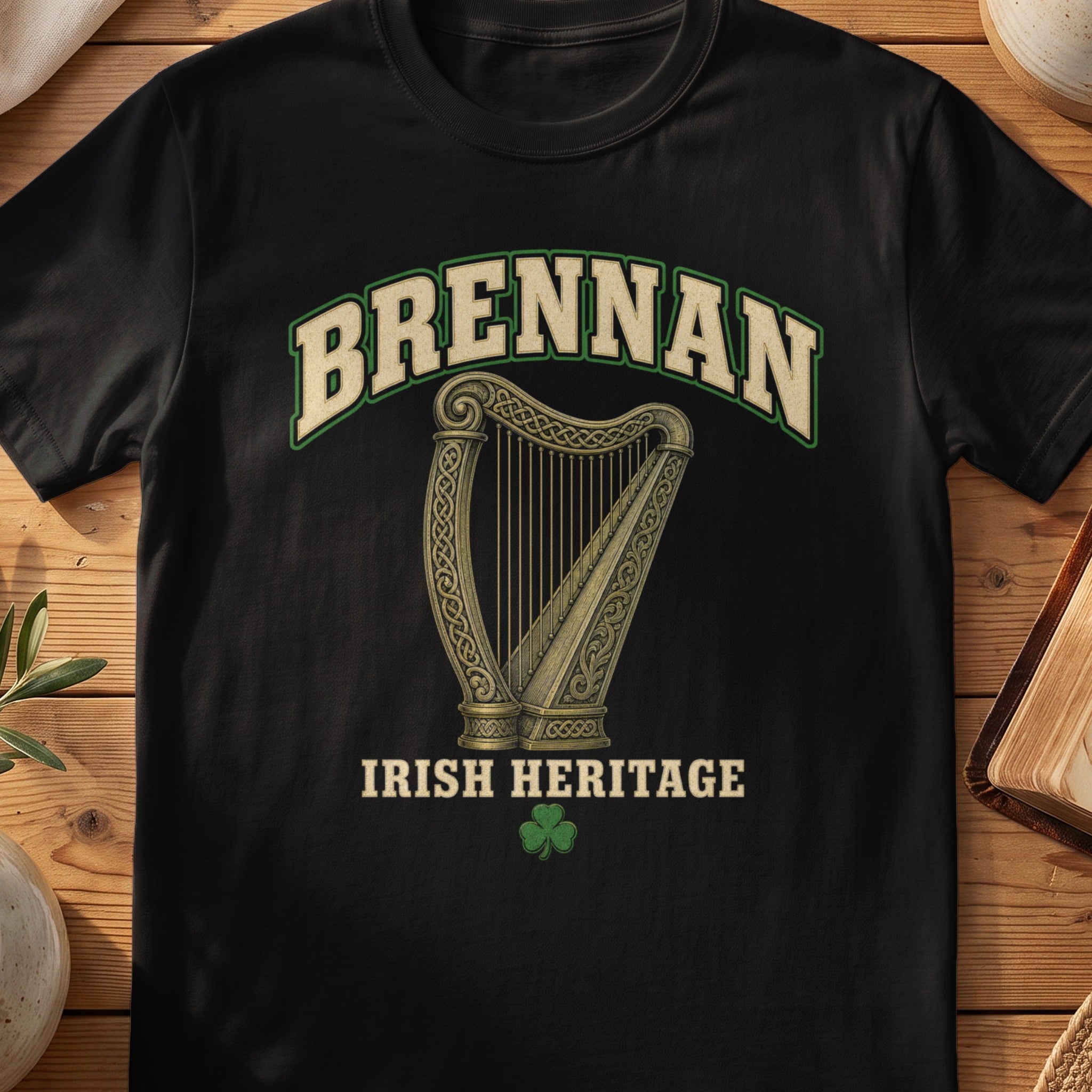 Brennan Irish harp T-shirt in Black, with cream surname lettering, a gold-toned harp, green shamrock and “Irish Heritage” text.