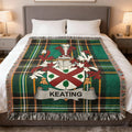 Green tartan blanket with Keating family crest and name.