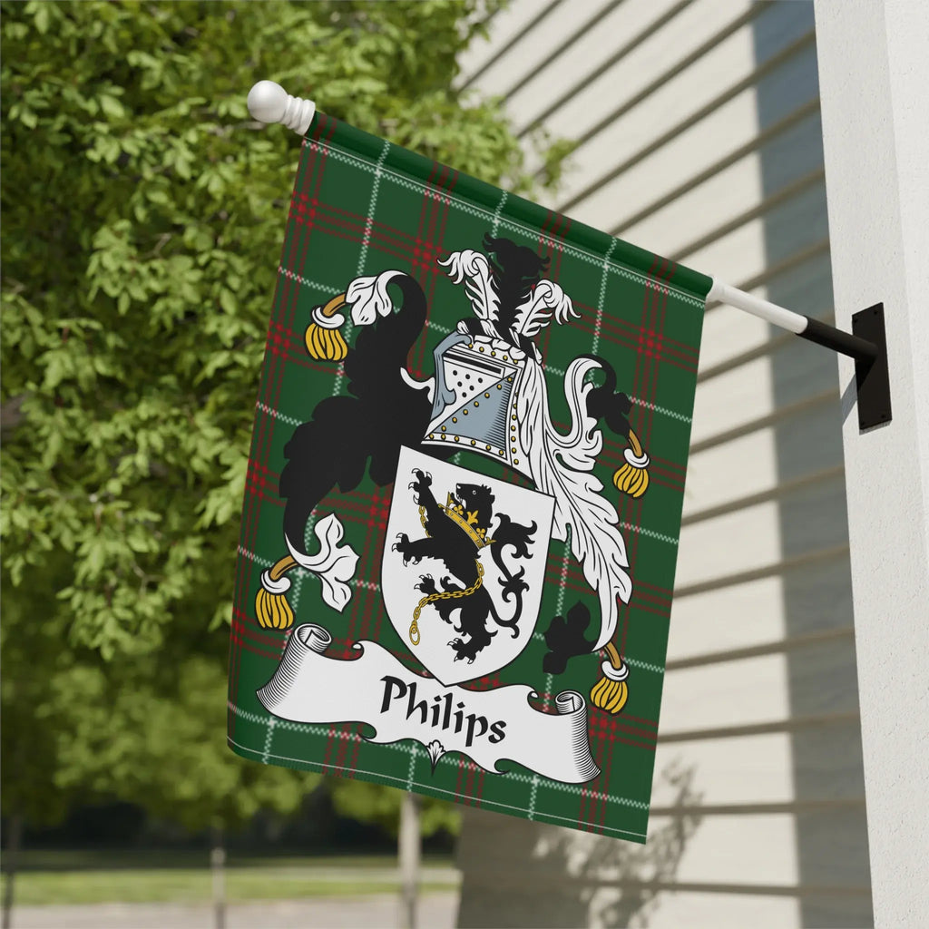 Green plaid flag with Phillips family crest displayed on a pole.