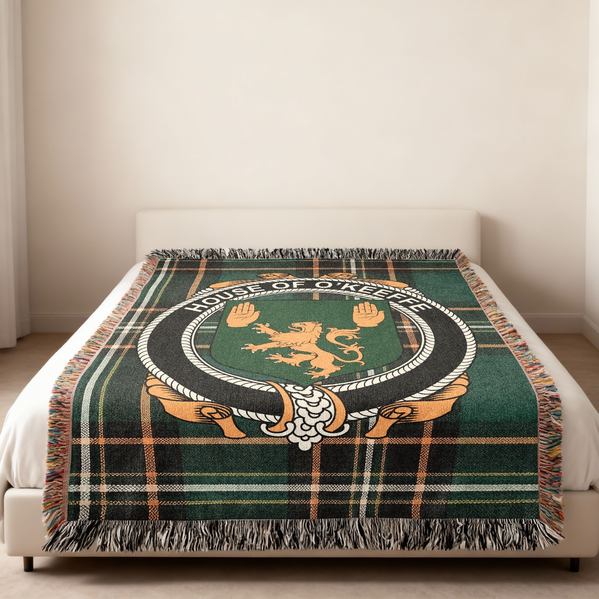 O'Keeffe family crest emblem woven blanket displayed on a bed
